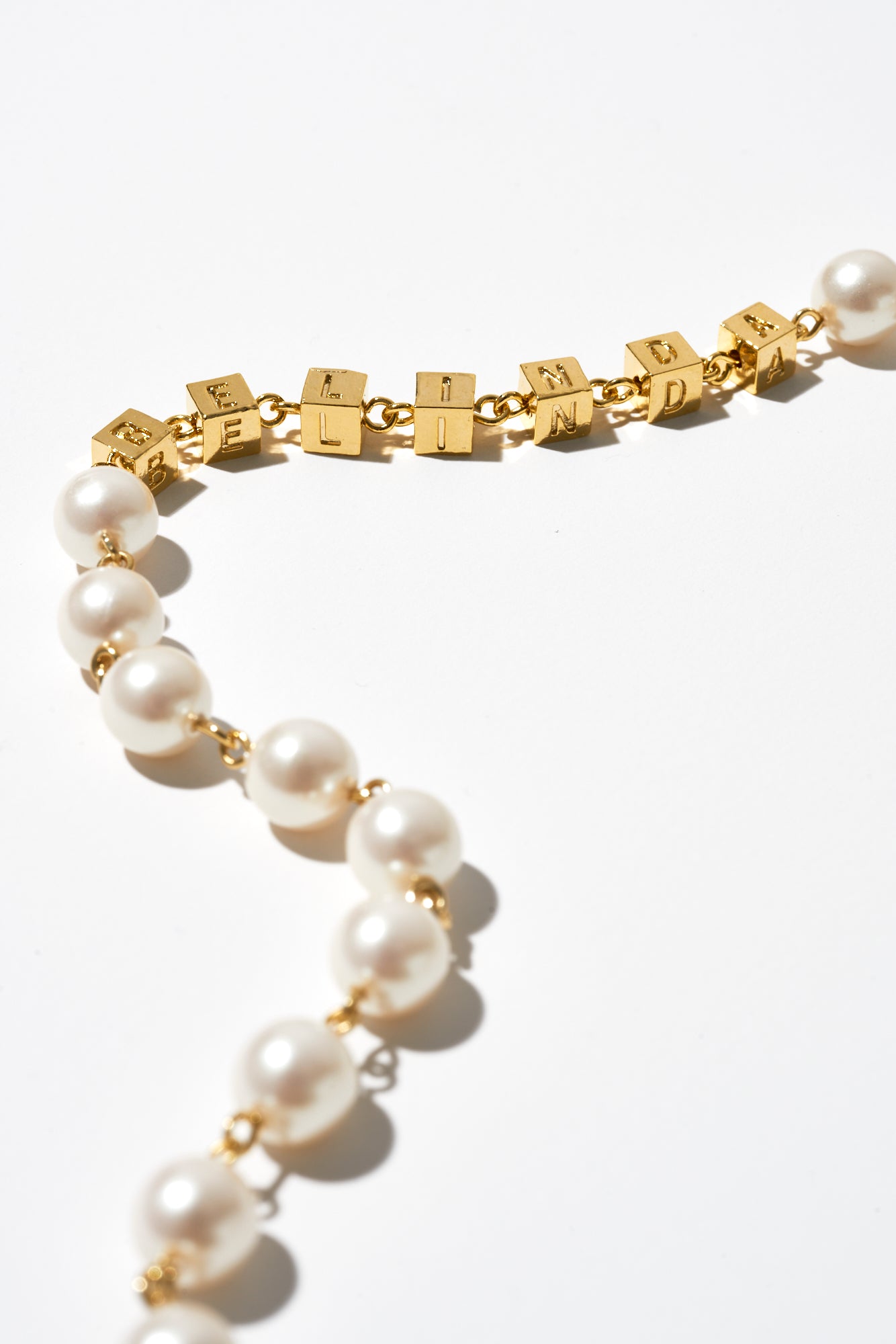 THE CROSS PEARL NECKLACE